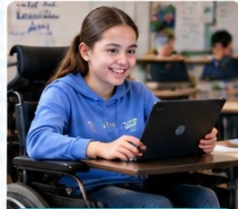 Student in a wheelchair working on a laptop in the classroom